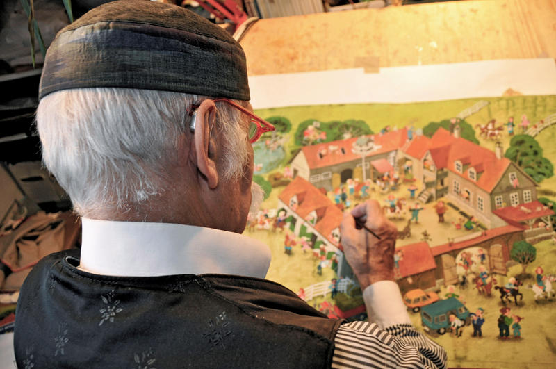 s:103:"Die bunten Wimmelbücher des Münchner Grafikers Ali Mitgutsch haben Generationen von Kindern geprägt.";